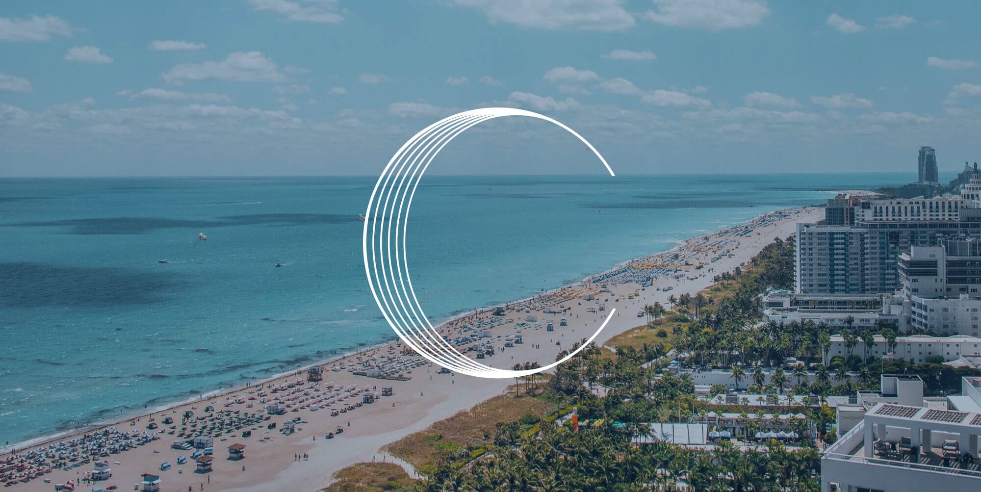 Jacober Creative Brand Identity for Calibre International Realty. Photo of Calibre icon over an image of Miami Beach
