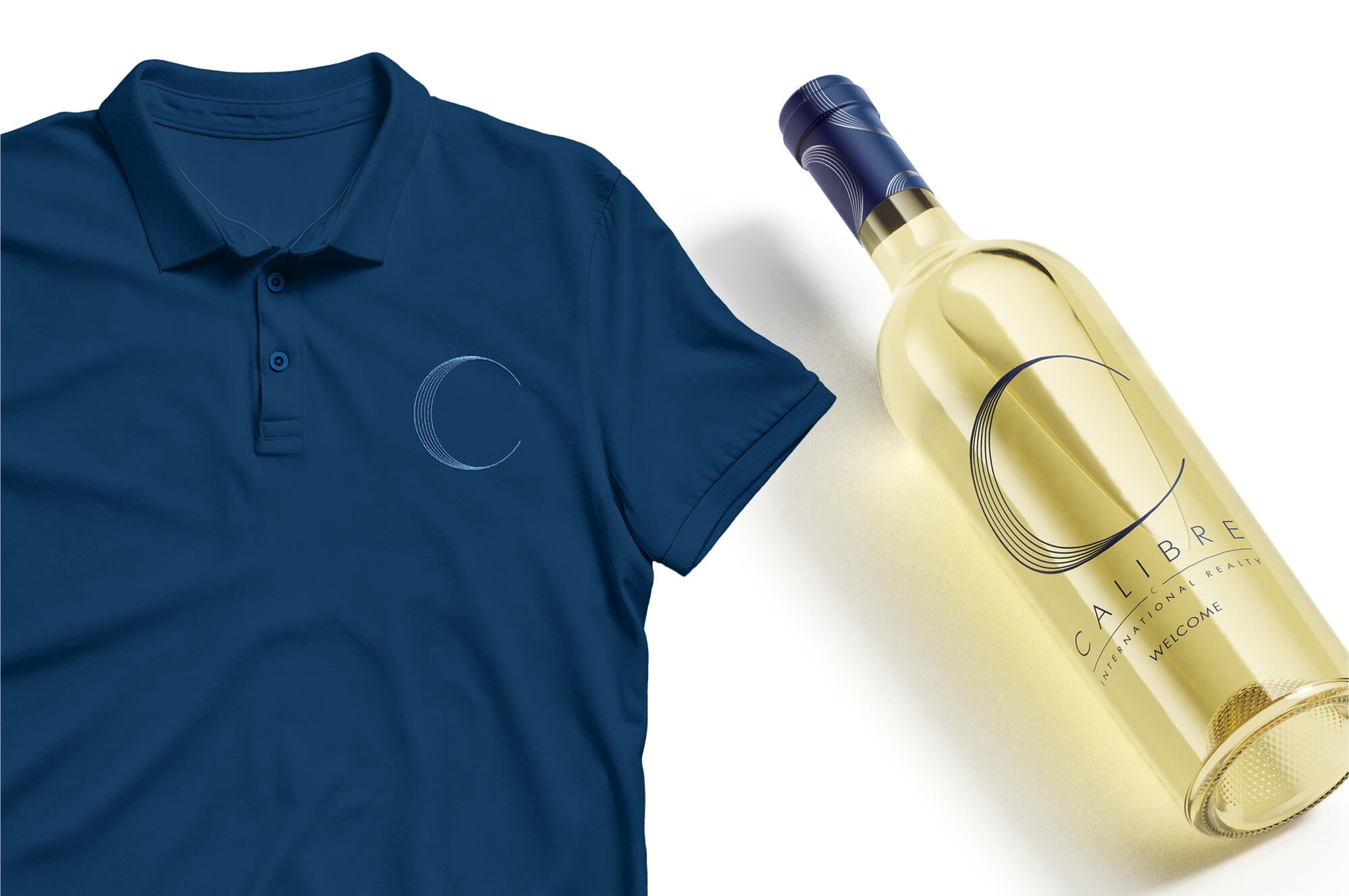 Jacober Creative Brand Identity for Calibre International Realty. Photo of branded polo and wine bottle